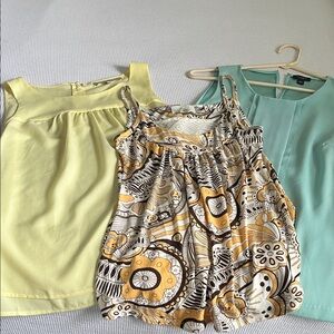 Three sleeveless blouses